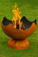 Wood burning fire pit on grass in the garden